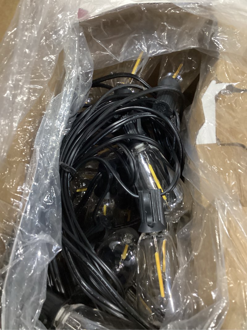 Condition photo showing As Is for brightever led outdoor string lights 100ft patio lights with 52 shatterproof st38 vintage edison bulbs, outside hanging light waterproof for porch, deck, garden, backyard, balcony, 2700k dimmable black wire 100ft-warm white