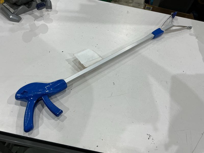 Condition photo showing As Is for e-z reacher 32-in aluminum/plastic/rubber/stainless steel reacher, ada compliant