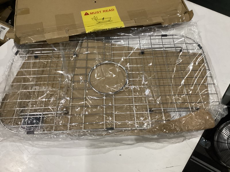 Condition photo showing New/Like New for sink protector grid 26-1/16" x 14-1/16", centered drain with corner radius 3-1/2" for kitchen sink centered drain with corner radius, 304 stainless steel material 26-1/16" x 14-1/16" centered drain
