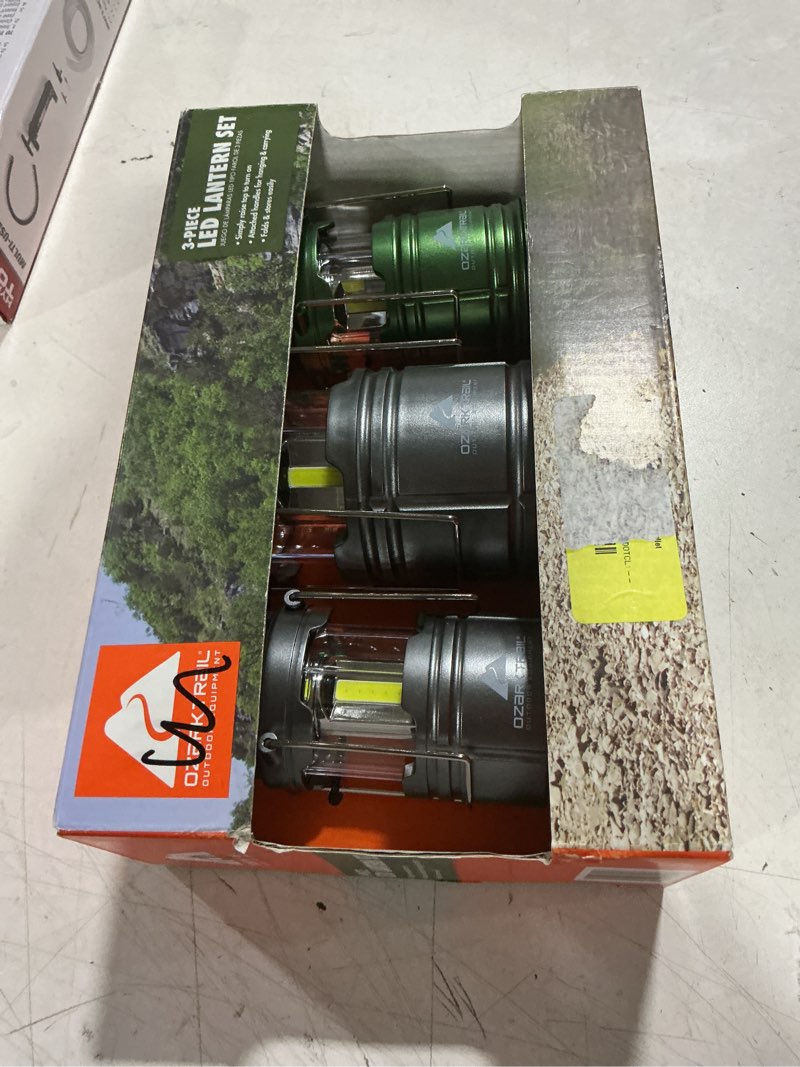 Condition photo showing As Is for ozark trail 3 pack aaa &aa batteries led camping lanterns