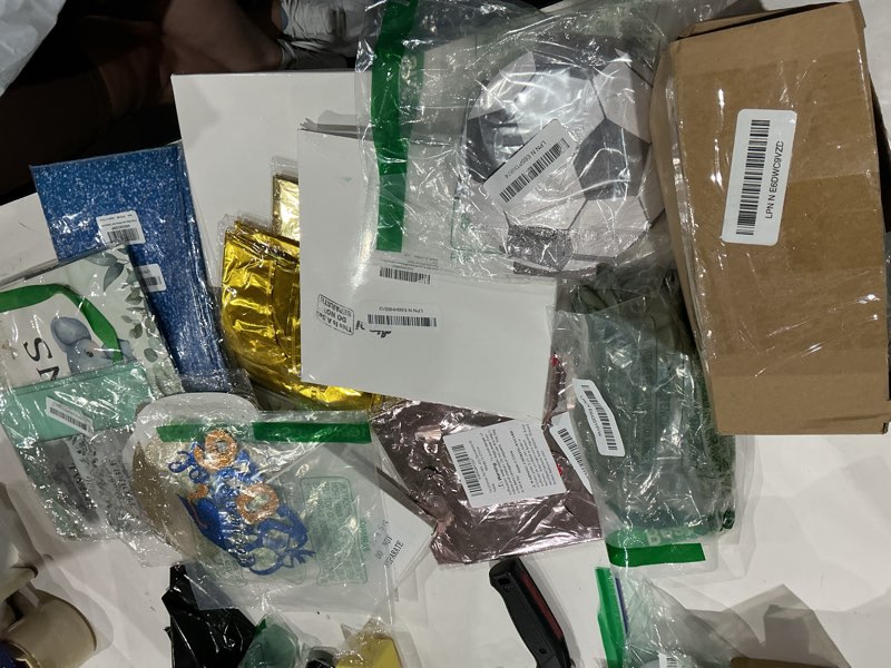 Condition photo showing As Is for assorted celebration/decoration supplies (may include a variety of styles, colors, and themes)