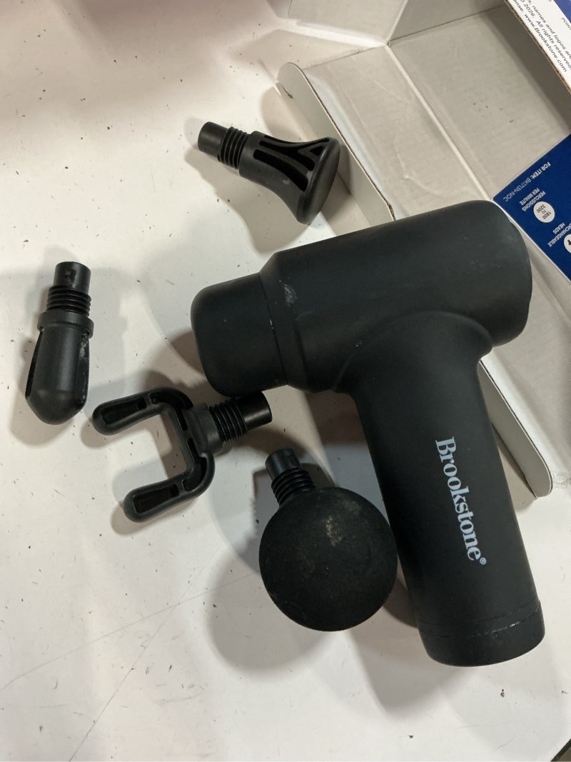 Condition photo showing As Is for brookstone deep tissue massage gun for pain relief & muscle recovery – 9-speed handheld percussion massager, 4 heads, type-c rechargeable, quiet, 3200 rpm, shockproof design