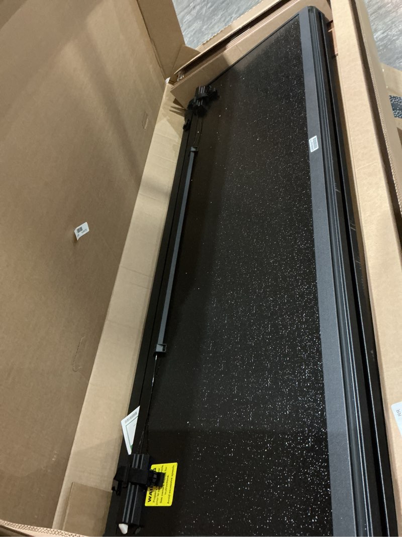 Condition photo showing Good Condition for gator efx hard tri-fold truck bed tonneau cover - heavy-duty truck bed protection - durable aluminum panels - hard folding tonneau cover - 2015-2020 ford f-150 (incl. raptor) - 5'7" bed hard tri-fold w/ cargo retriever 5' 7" bed