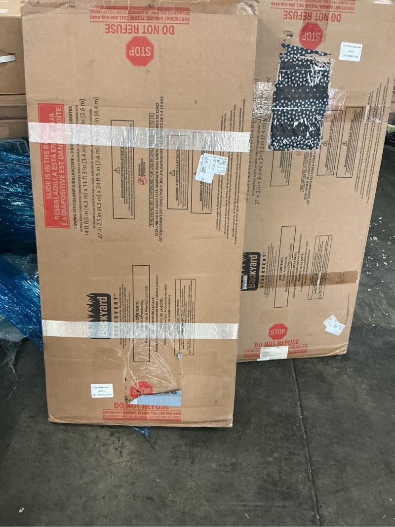 Condition photo showing As Is for (incomplete, pick up 2 boxes )backyard discovery lakewood cedar wood swing set with wave slide, clubhouse, playhouse, snack bar window, picnic area, belt swings, trapeze, full front door, windows, step ladder, outdoor playset