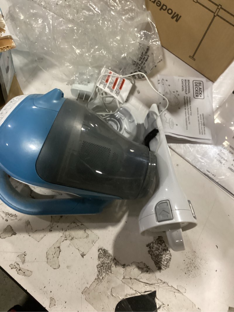 Condition photo showing As Is for black+decker dustbuster advancedclean handheld vacuum cordless, compact home and car vacuum with crevice tool ,rotating nozzle and charging station, large dust bowl (chv1410l)
