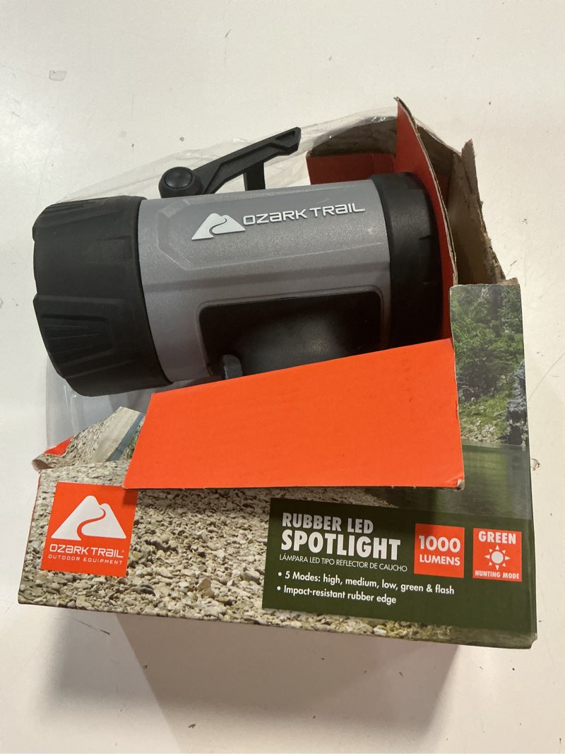 Condition photo showing As Is for ozark trail 1000 lumen led spotlight with rubber bumpers with green hunting flashlight light, aa battery
