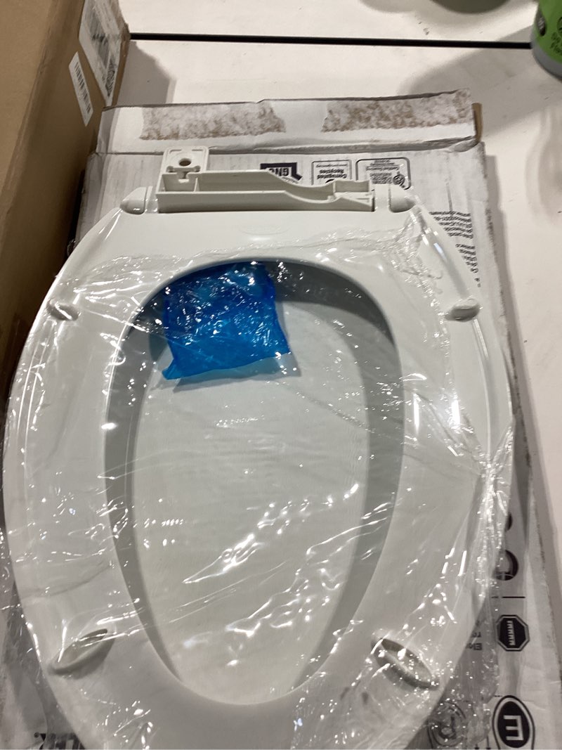 Condition photo showing As Is for kohler 20110-0 brevia, slow close toilet seat, elongated toilet seat, grip-tight bumpers quick-attach hardware, white white elongated quiet-close