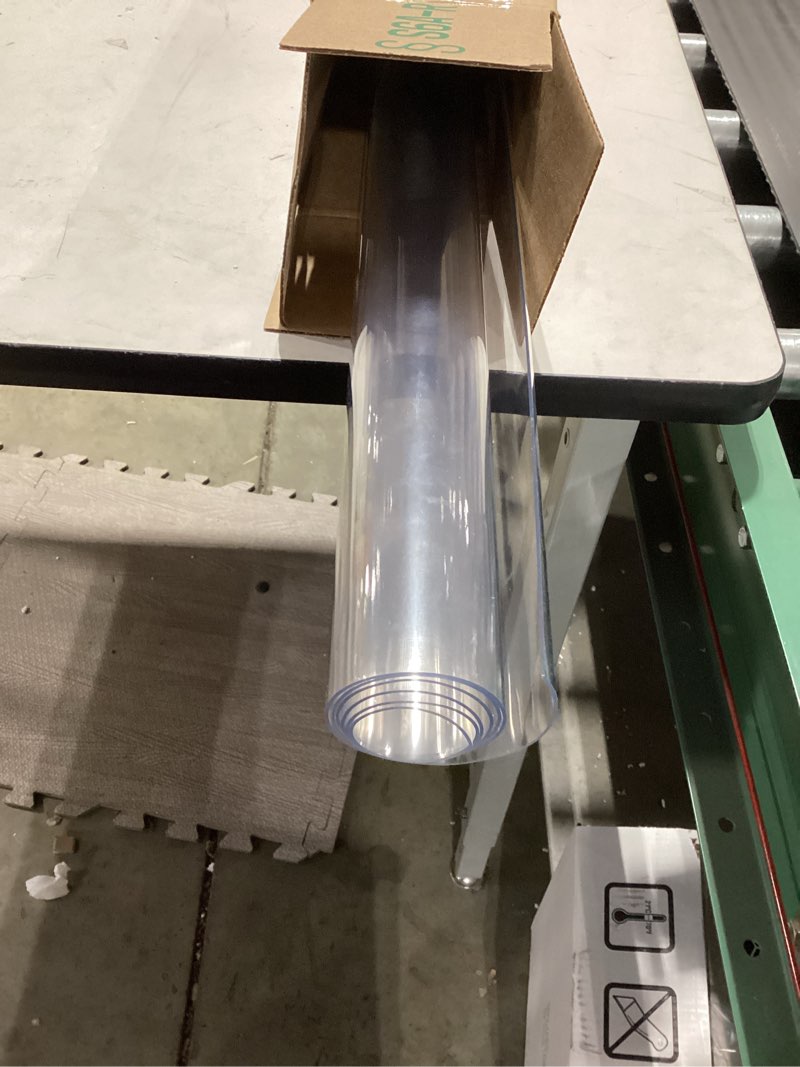 Condition photo showing As Is for Warmstar Clear Table Protector 2mm Thick, 28 x 51 Inch Clear Table Cover Protector, Plastic Table Cover, Clear Desk Mat Desk Pad, Desk Protector Mat for Coffee Table, Writing Desk, Dining Room 51" x 28"