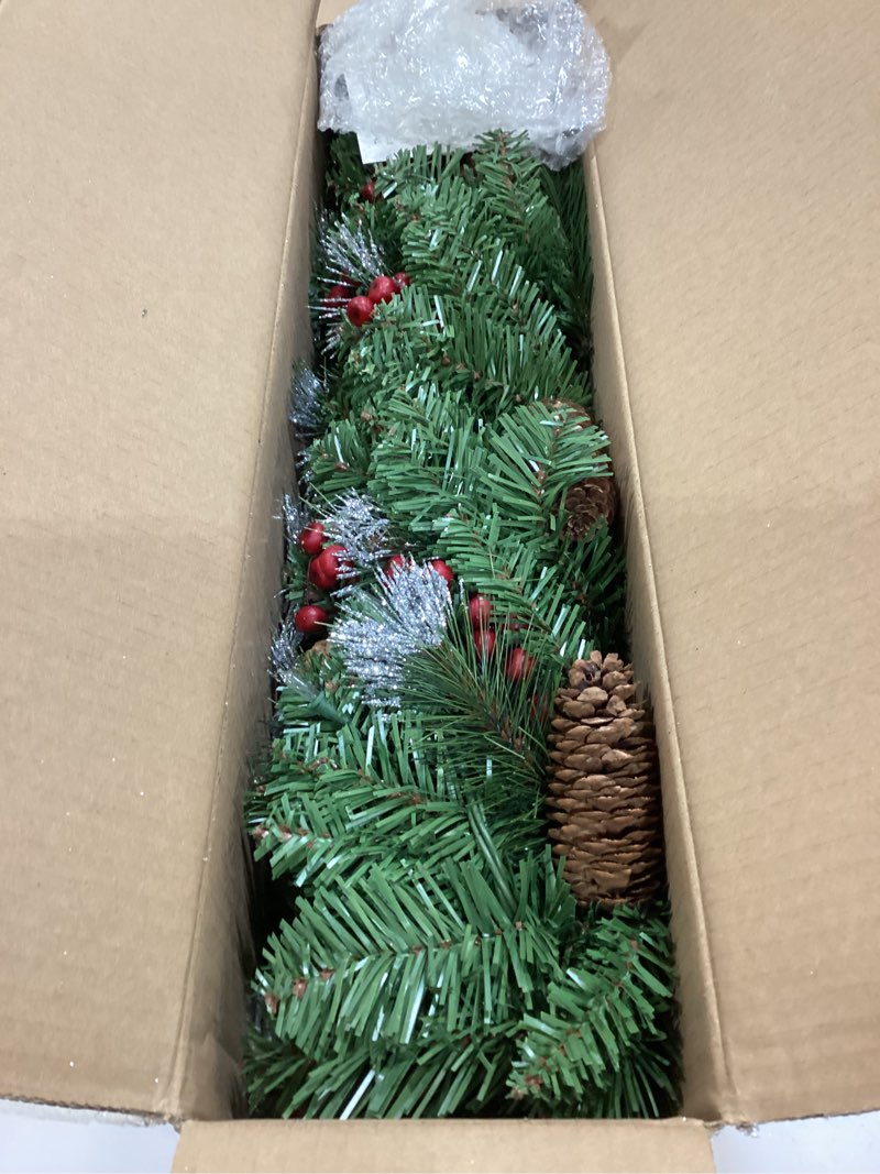 Condition photo showing Good Condition for national tree company 9 ft pre-lit crestwood spruce artificial christmas garland, christmas decoration with glitter, pinecones, red berries, 50 clear lights, 180 tips, green plug in tree