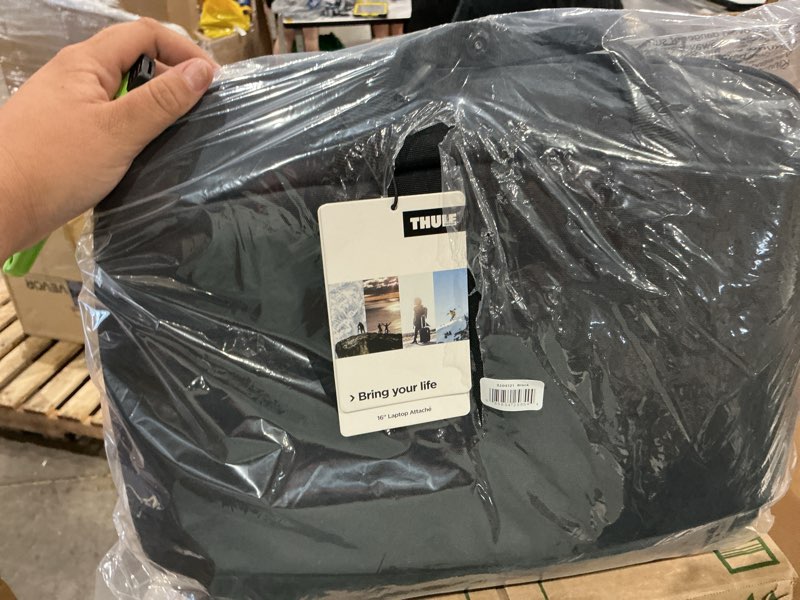Condition photo showing New/Like New for 16” thule black laptop bag