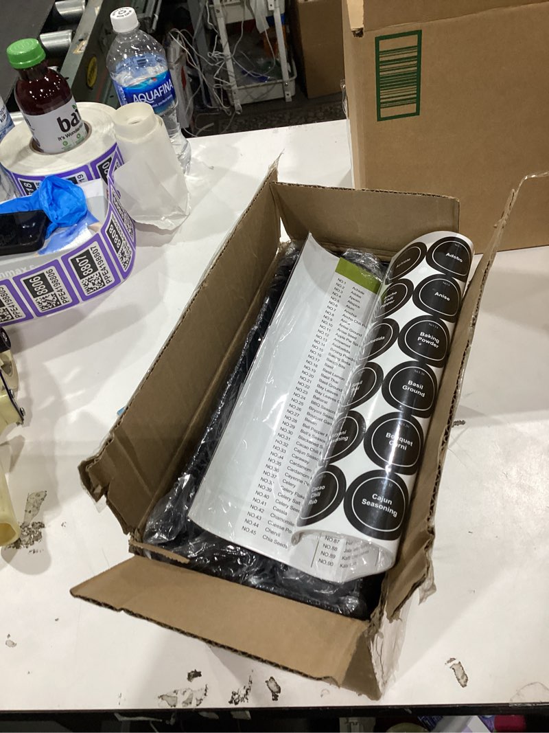 Condition photo showing New/Like New for spaceaid spice rack organizer with 28 spice jars, 386 spice labels, chalk marker and funnel set for cabinet, countertop, pantry, cupboard or door & wall mount - 28 jars, 13.4" w × 10.8" h, black 28 jars, 13.4"w × 10.8"h black