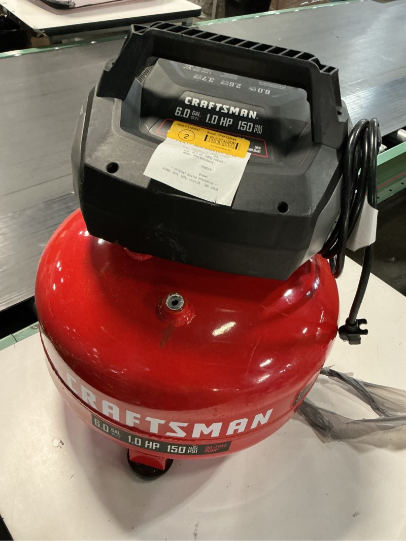 Condition photo showing As Is for craftsman 6 gallon portable pancake air compressor, oil-free, max 150 psi, 1 hp, 2.6 scfm @ 90 psi, with 25 ft air hose and 2 quick couplers, model cmxecxa0210641c