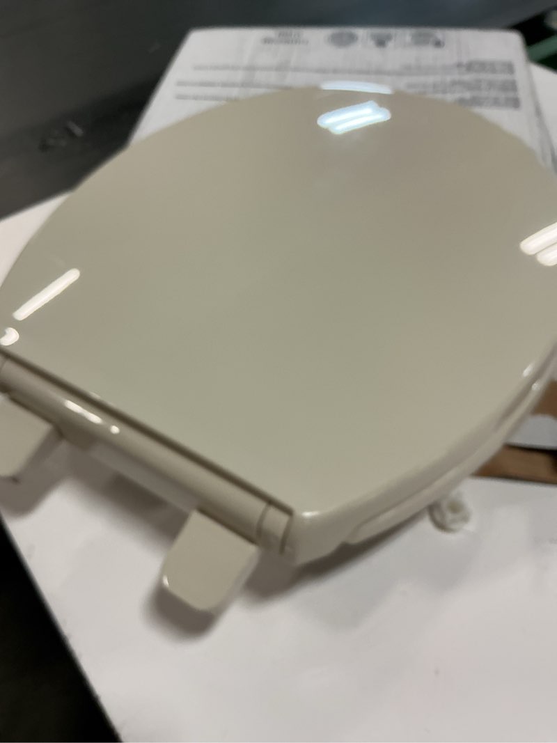 Condition photo showing As Is for KOHLER K-4775-47 Brevia Round Toilet Seat with Quick-Release Hinges And Quick-Attach Hardware For Easy Clean, Almond Round Almond