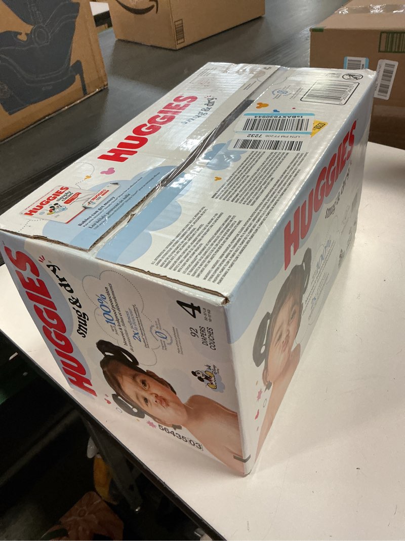 Condition photo showing New/Like New for Huggies Size 4 Diapers, Snug & Dry Baby Diapers, Size 4 (22-37 lbs), 92 Count, Packaging May Vary Size 4 92