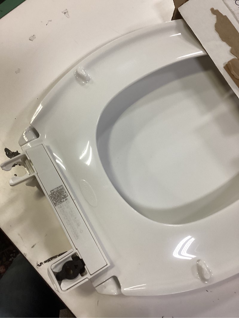 Condition photo showing As Is for kohler 4636-rl-0 cachet readylatch elongated toilet seat slow close, soft close toilet seat quiet lid, contoured grip-tight bumpers installation hardware, apartment essentials, white white elongated ready latch