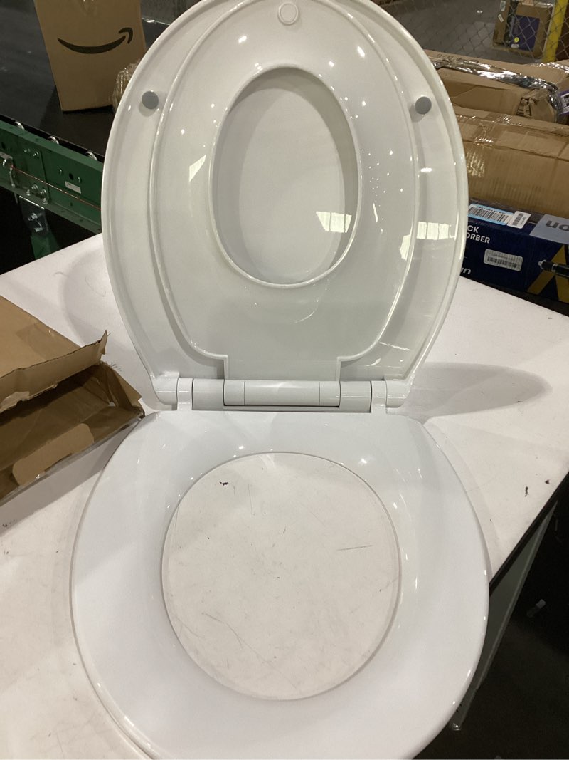 Condition photo showing As Is for 1m family toilet seat, patented slow close & quick releasing technology, anti-wiggling, easy to install and clean, standard round with toddler seat built in (1 piece) 1 round with toddler seat built in
