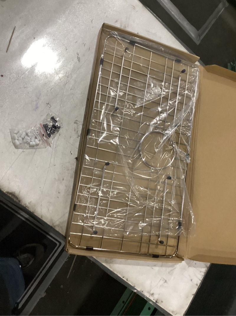 Condition photo showing New/Like New for Sink Grid 26" X 14 1/16", Kitchen Sink Grid, Sink Protectors for Kitchen Sinks, Stainless Steel Material, Sink Bottom Grid with Rear Drain for Single Bowl (26" X 14 1/16") 26" X 14 1/16" with Rear Drain
