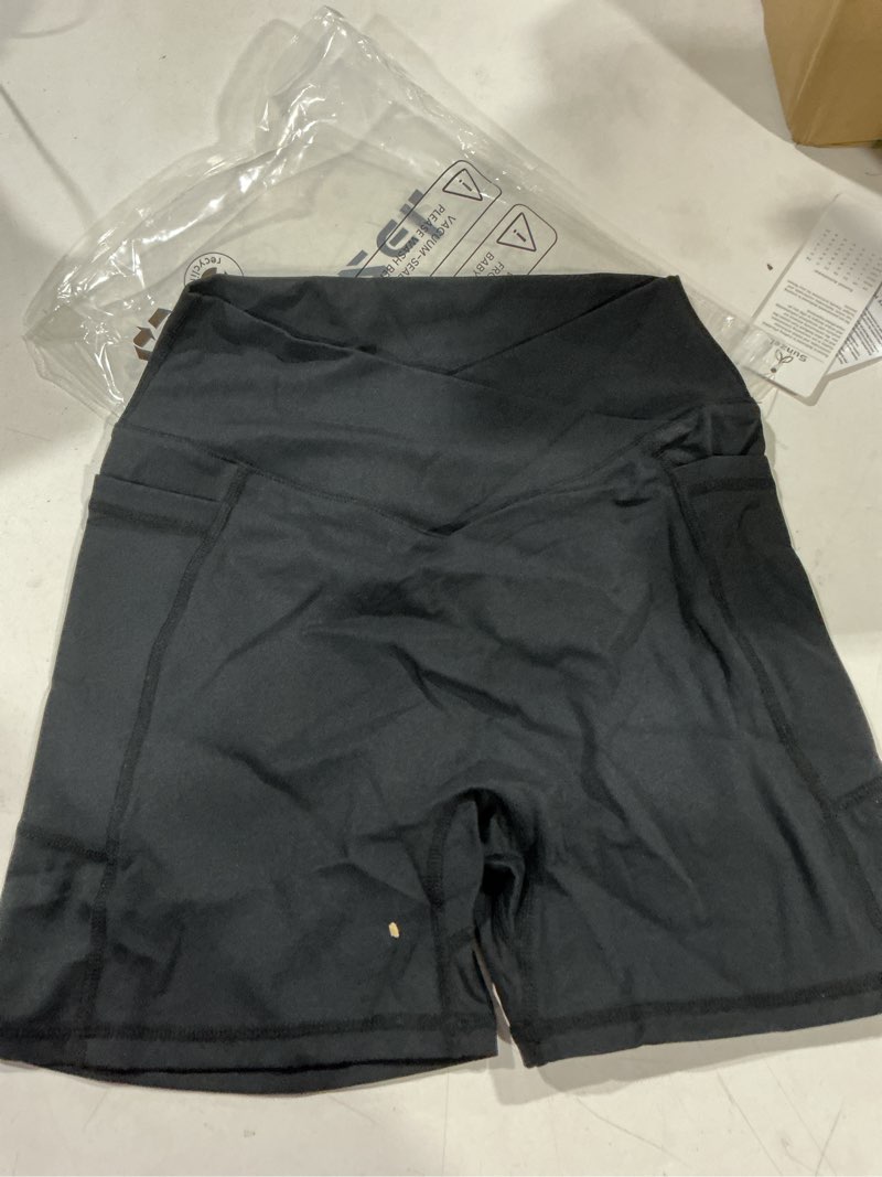 Condition photo showing Good Condition for sunzel women's high waisted crossover waist biker shorts with pockets | 4-inch inseam, high waisted, tummy control, crossover waist, butt lifting, hidden butt scrunch, side pockets 4" inseam x-small black