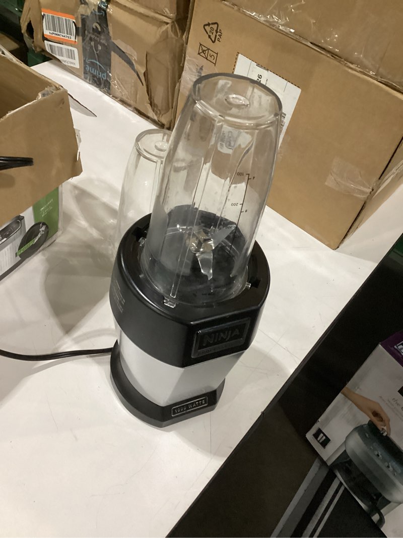 Condition photo showing Good Condition for similar to stock photo!!! ninja | blender | nutri pro | single serve | for smoothies, salsa, shakes and frozen drinks | includes 2 smoothie cups & lids | crushes ice, fruit & veggies |silver | bn401 auto blend 1000-peak-watts