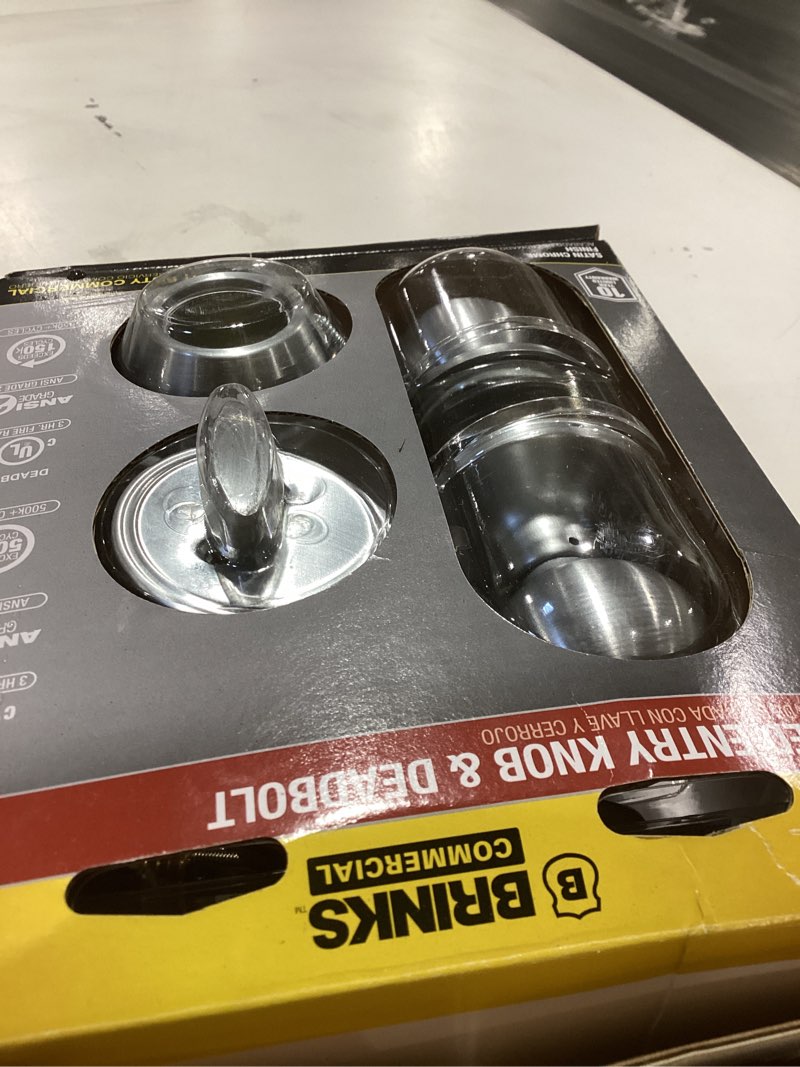 Condition photo showing As Is for brinks commercial light duty commercial satin chrome interior/exterior single-cylinder deadbolt keyed entry door knob combo pack