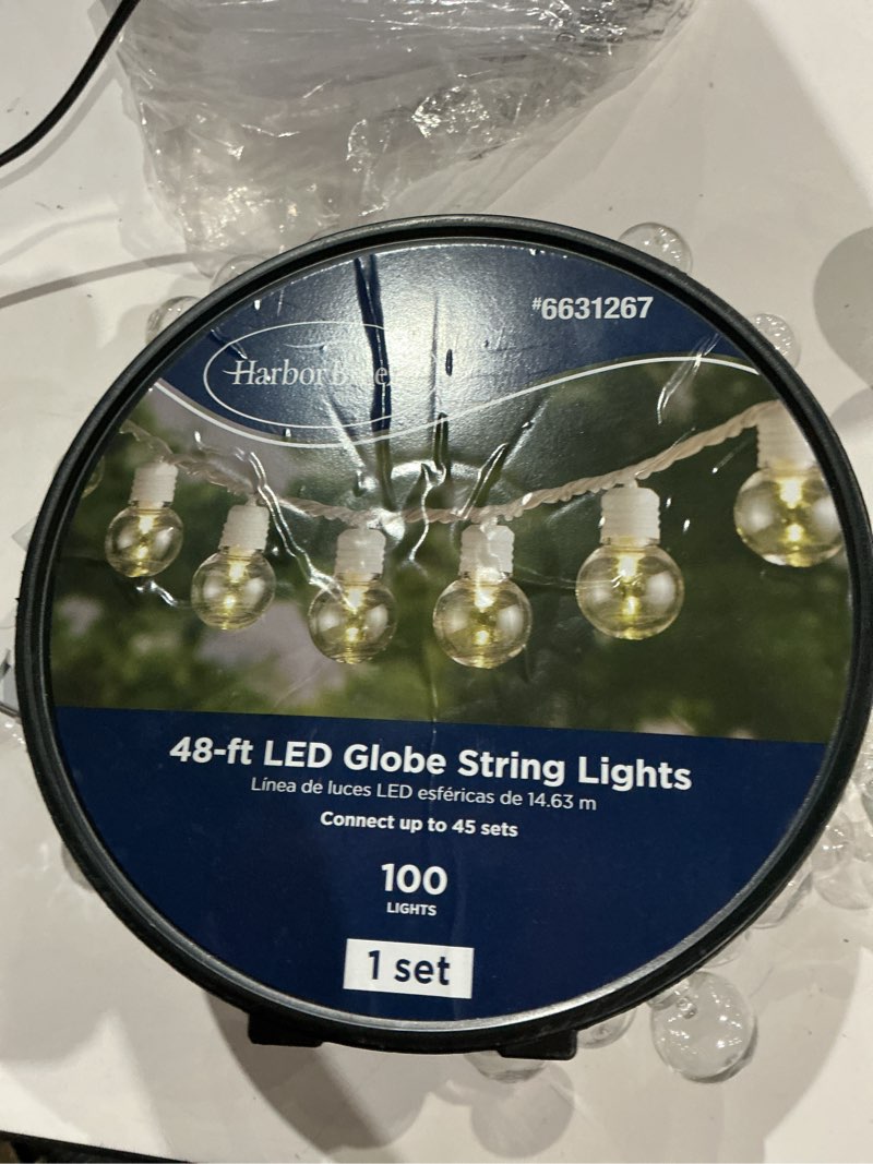 Condition photo showing As Is for questions & answers for harbor breeze 48-ft plug-in white indoor/outdoor string light with 100 white -light led globe bulbs