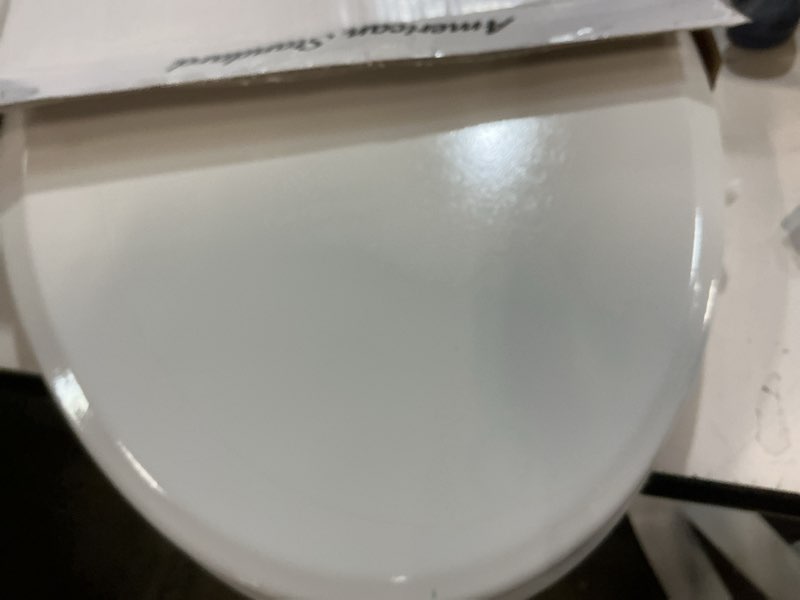 Condition photo showing As Is for american standard bedminster wood white elongated soft close toilet seat