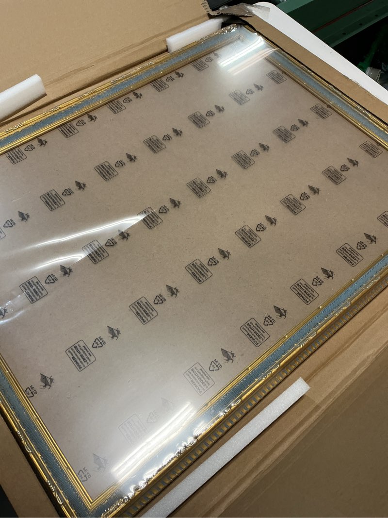 Condition photo showing Good Condition for GULETHUN 18x24 Picture Frame Gold - Vintage Photo Frame 18 by 24, Retro Home Decor Wall Hanging Gallery Frames, Sturdy, Plexiglass, Ornate Gold Raised Poster Frame for Vertical & Horizontal Display Gold 18x24in