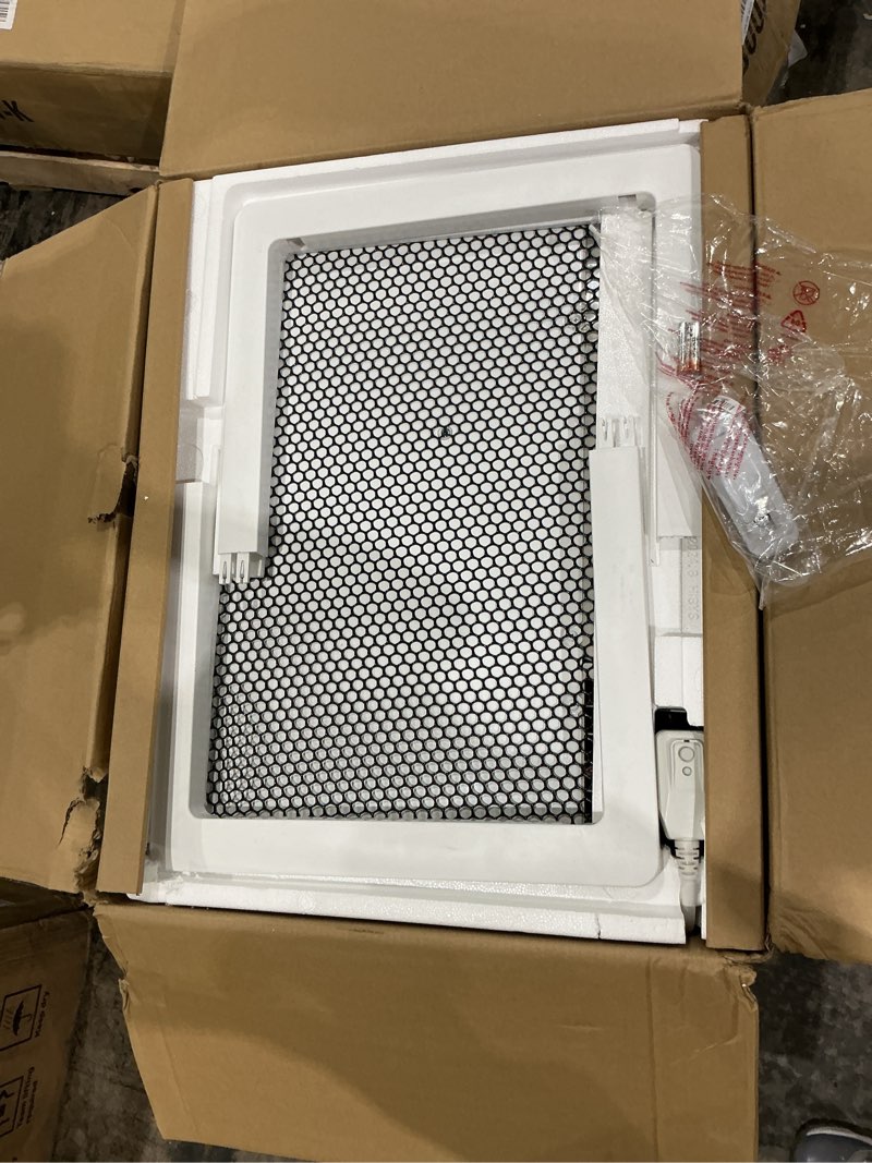 Condition photo showing As Is for lg 11,800 btu through the wall air conditioner, 115v, cools up to 530 sq. ft. for bedroom, living room, apartment, with remote, 3 cool & fan speeds, universal design fits most sleeves, white