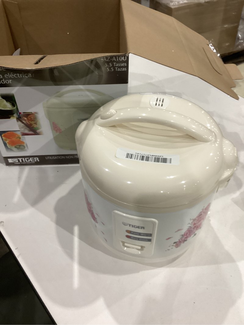Condition photo showing As Is for tiger jaz-a10u-lf 5.5 cup capacity white rice cooker with non-stick inner pot, retractable power cord, and keep warm up to 12 hours (flower)