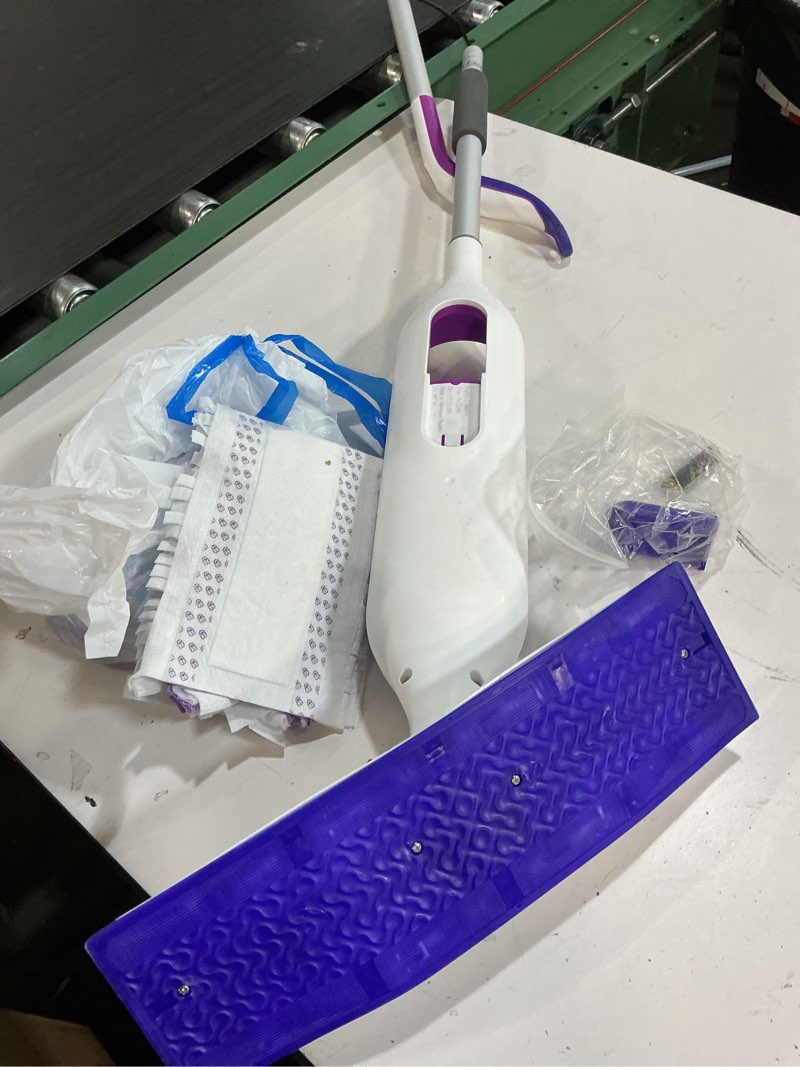 Condition photo showing As Is for swiffer powermop multi-surface mop kit for floor cleaning, includes powermop, 2 mopping pad refills, 1 cleaning solution with fresh scent and 2 batteries purple and white