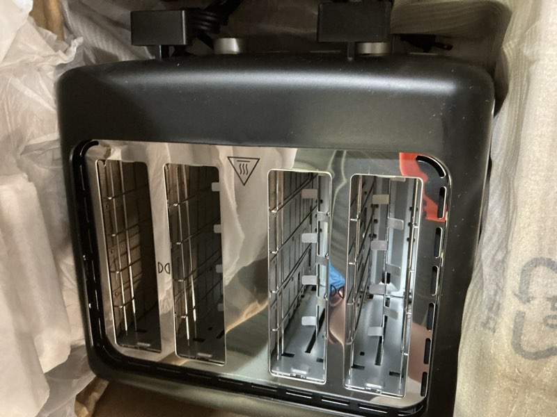 Condition photo showing Good Condition for amazon basics 4 slice toaster, 7 browning settings, extra wide slots for bagels and specialty breads, removable crumb tray, cancel/defrost/bagel buttons, 1500w, black & silver 4 slice matte black front