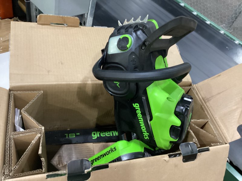 Condition photo showing As Is for USED NOT TESTED Greenworks 80V 18\" Brushless Cordless Chainsaw (Great For Tree Felling, Limbing, Pruning, and Firewood), 75+ Compatible Tools, 4.0Ah Battery and Charger Included 18\" (2.5Ah) 2.5KW Motor