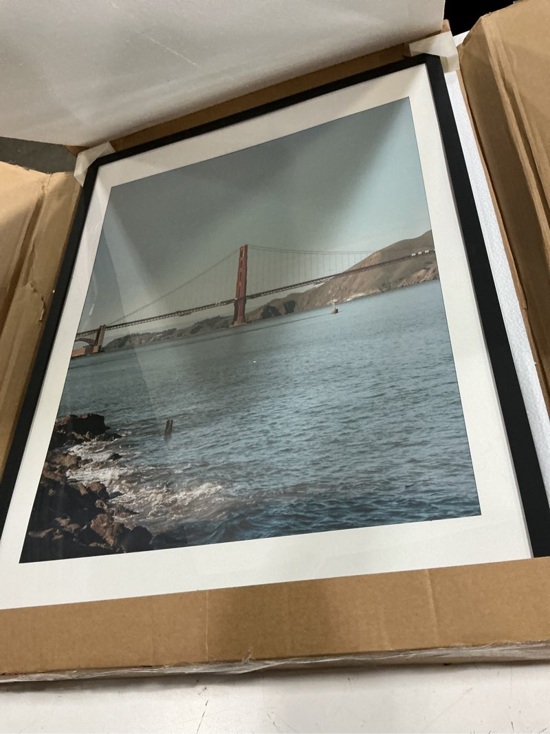 Condition photo showing New/Like New for frametory, 18x24 picture frame with mat for 16x20 picture - high definition glass wide molding - preinstalled wall mounting hardware (black, 1 pack) 18x24 (1 pack) black