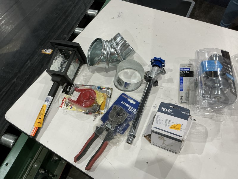 Condition photo showing As Is for assorted home improvement lot (small tools, screw, home accessories, etc.)