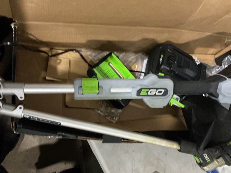 Condition photo showing As Is for ego powerload 56-volt 15-in telescopic shaft battery string trimmer 2.5 ah (battery and charger included)