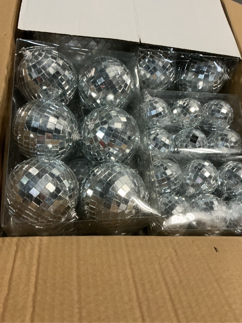 Condition photo showing New/Like New for the dreidel company mirror disco ball 36-pack variety of sizes, silver hanging ball with attached string for ring, reflects light, fun party home bands decorations