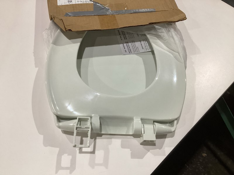 Condition photo showing As Is for Mayfair Aurora Slow Close Toilet Seat, Easy Clean Hinges and Adjustable Perfect Fit Plastic Seat, Made in USA, Elongated, White Elongated Traditional Hinge