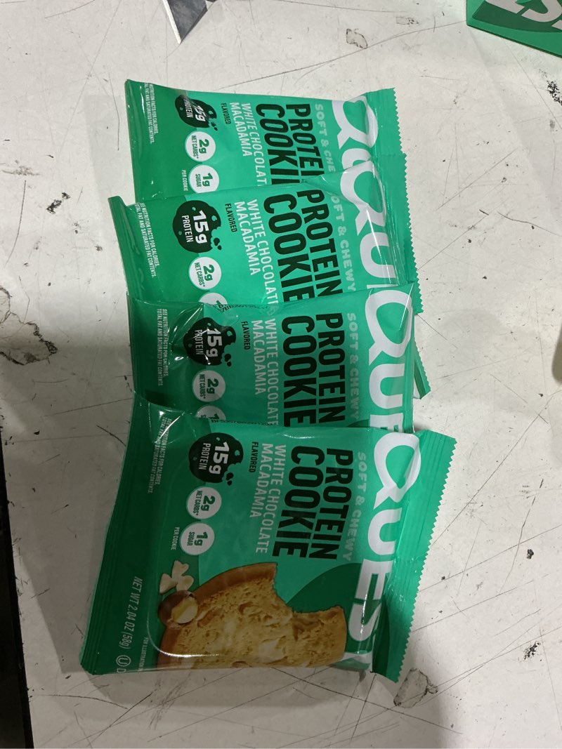 Condition photo showing As Is for (bb: 12/23/26) quest nutrition, 15g protein soft cookie, white chocolate macadamia flavor, high protein, low carb, 4 count