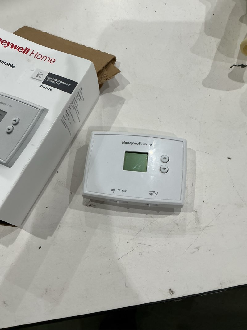 Condition photo showing As Is for honeywell thermostat, non-programmable thermostat, white, rth111b1024/e1