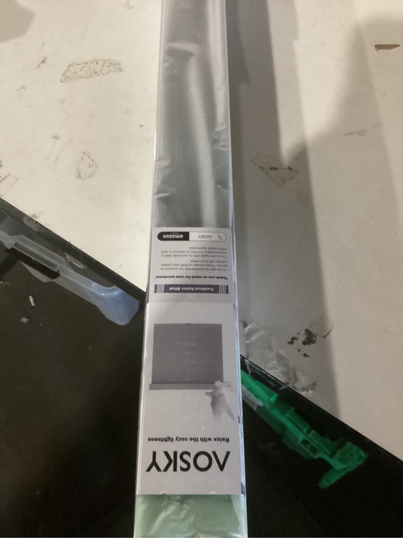 Condition photo showing New/Like New for aosky blackout roller shades cordless blinds for windows, free-stop shades with valance, thermal insulated fabric, uv protection, natural woven blinds for home and office (34" w x 72" h, black)