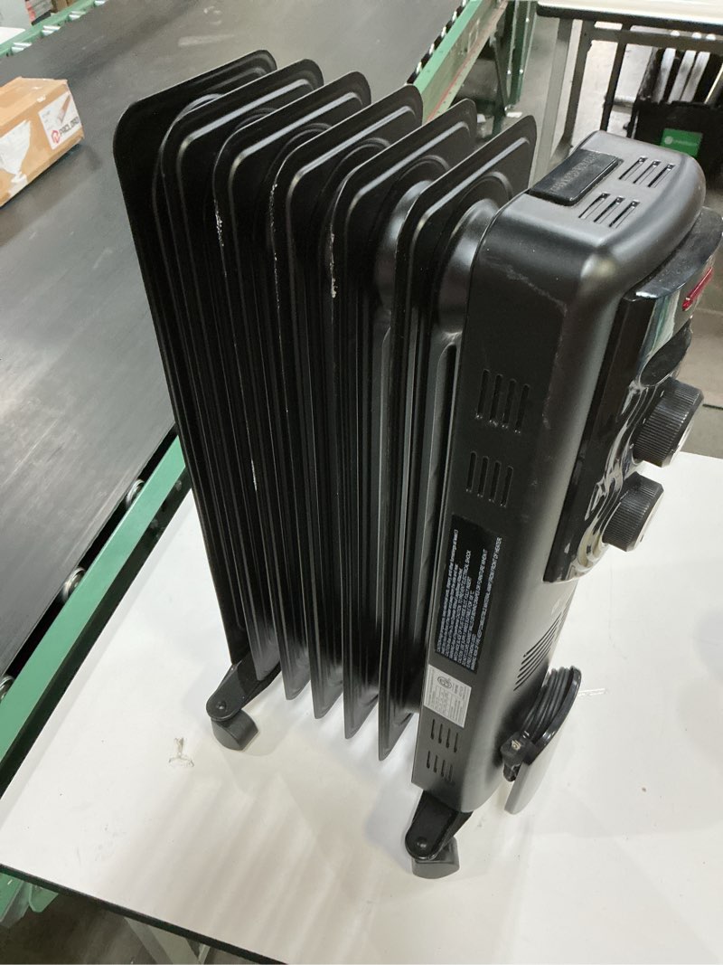 Condition photo showing item condition for Utilitech 1500 -Watt Oil-filled radiant Utility Indoor Electric Space Heater with Thermostat