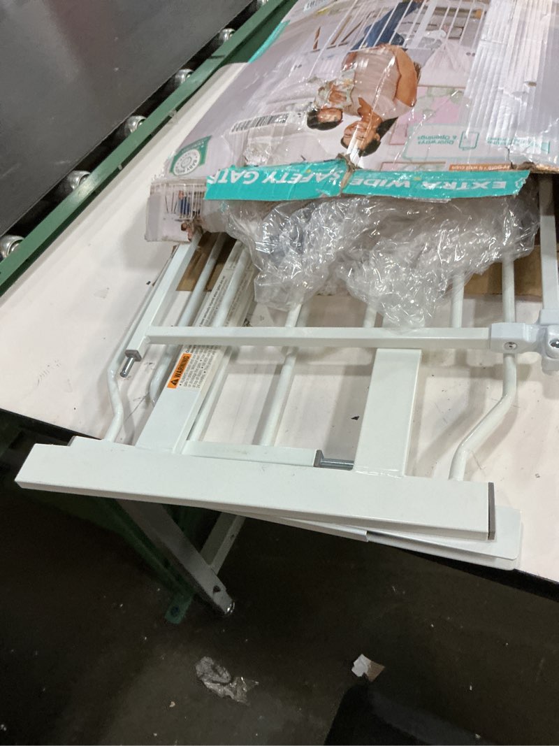 Condition photo showing As Is for regalo safety 38" baby gate for doorways & bottom of stairs, pressure mount design for babies, toddlers & pets, tested & safe for 30 years, american designed, american owned, white white 29-38.5"w x 30"h