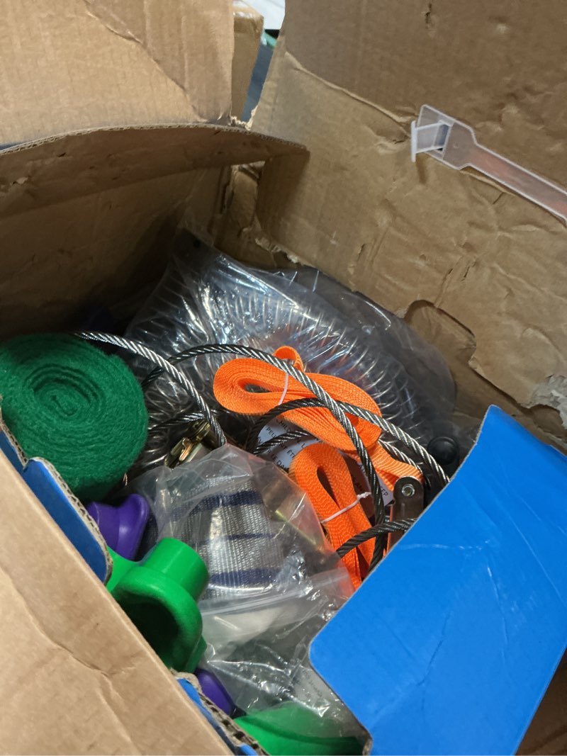 Condition photo showing As Is for zip line kit for kids and adults, 100/120/150/200ft, up to 350 lbs, removable trolley, rustproof stainless steel, quick setup with ratchet, safety harness, backyard adventure fun w/climbing holds 120' zipline kit
