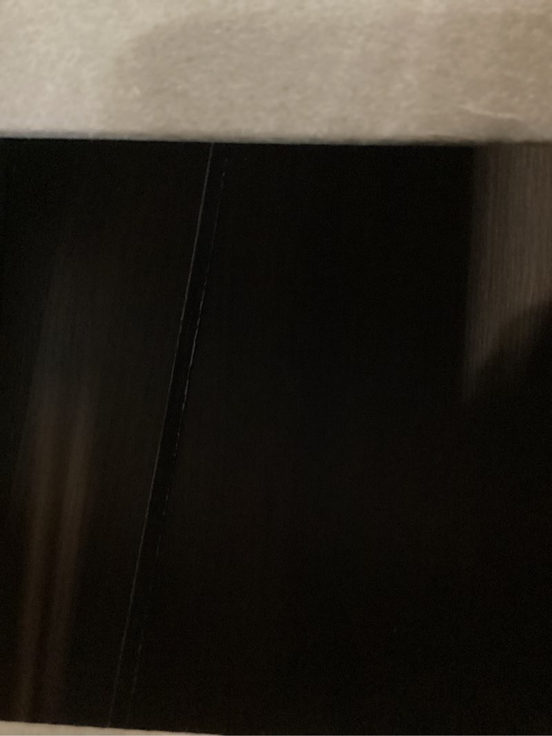 Condition photo showing As Is for dark wood wall paneling
