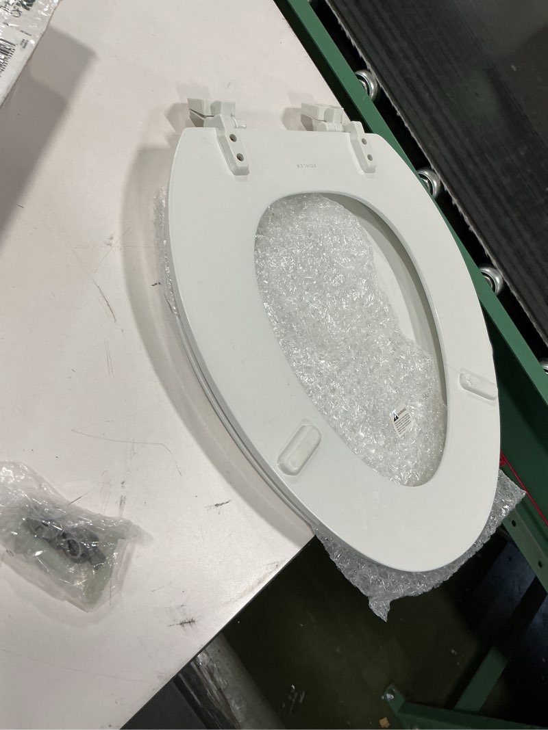 Condition photo showing As Is for KOHLER 4647-0 Stonewood Elongated Toilet Seat, Elongated Wood Seat for Standard Toilets, Comes with Color-Matched Plastic Hinges, Home Essentials, White White Elongated