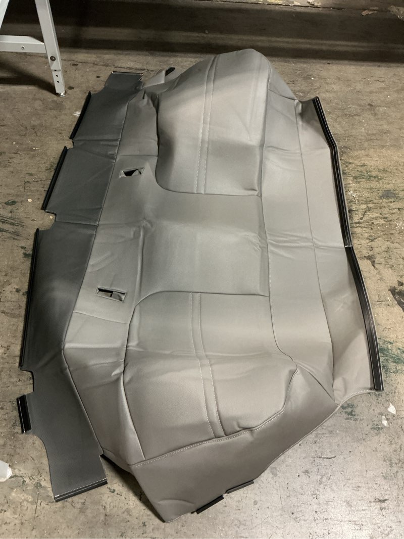Condition photo showing As Is for ( similar) Dark Titanium Rear Seat Cushion Cover - GM