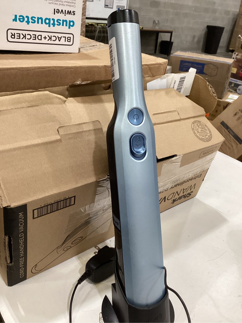 Condition photo showing As Is for shark wv201blbrn wandvac cordless hand vac, lightweight and portable at 1.4 lbs. with powerful suction, charging dock, one-touch empty for car & home, cove blue