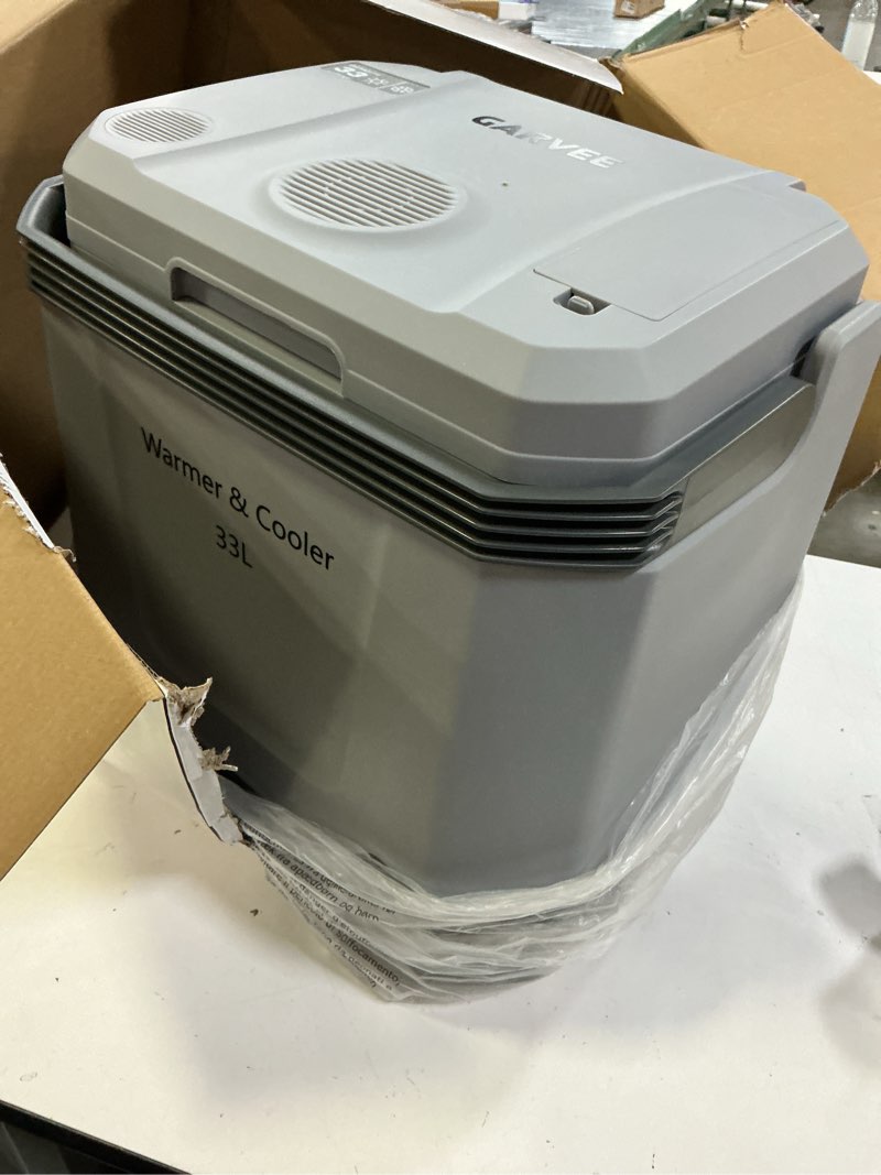 Condition photo showing Good Condition for (grey color) garvee 35 quart (33 l) electric cooler & warmer, portable car refrigerator with automatic locking handle, 12v car cooler for vehicle & trucks, 110v ac home power cord, plug in coolers grey 