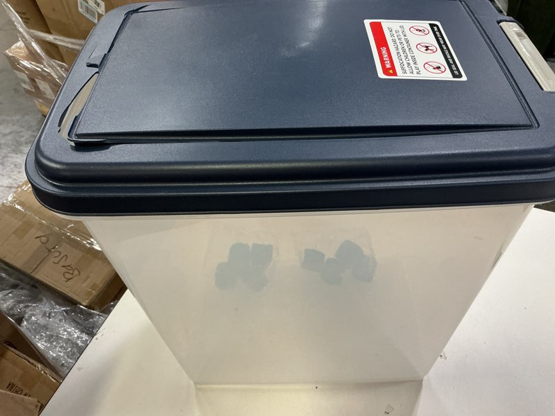 Condition photo showing As Is for IRIS USA 30 Lbs / 33 Qt WeatherPro Airtight Pet Food Storage Container with Attachable Casters, For Dog Cat Bird and Other Pet Food Storage Bin, Keep Fresh, Translucent Body, Easy Mobility, Navy 30 lbs Navy