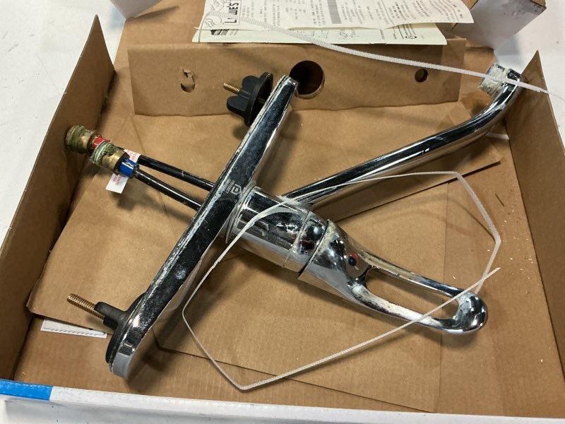 Condition photo showing As Is for project source wakebridge polished chrome single handle mid-arc kitchen faucet (deck plate included)